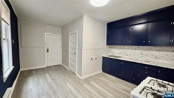 a view of kitchen and wooden floor