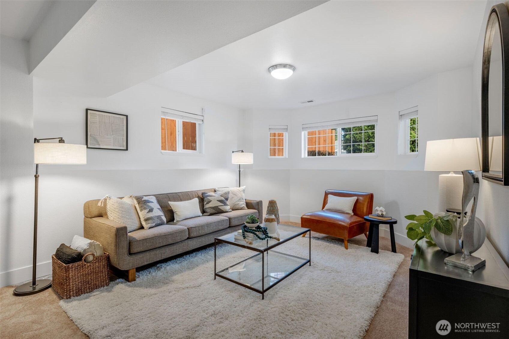 2 109th Place Southeast Everett, WA 98208 - Photo 19 of 40 a living room with furniture and a potted plant on a dresser