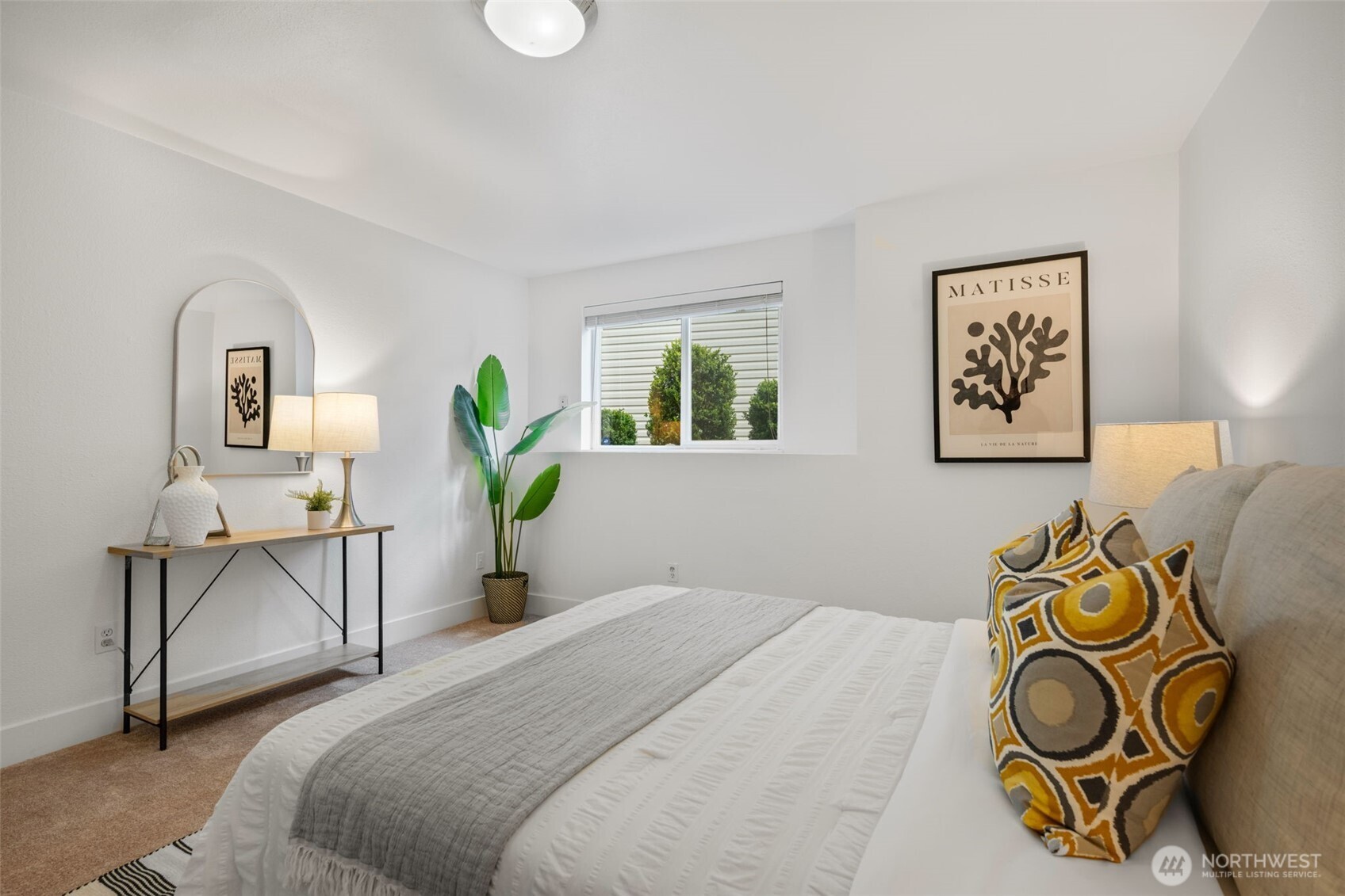 2 109th Place Southeast Everett, WA 98208 - Photo 23 of 40 a bedroom with a bed and painting on the wall