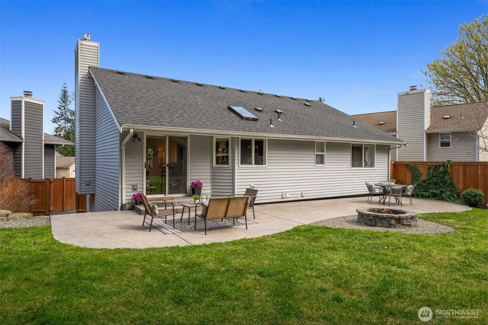 2 109th Place Southeast Everett, WA 98208 - Photo 29 of 40 a front view of house with a garden and patio