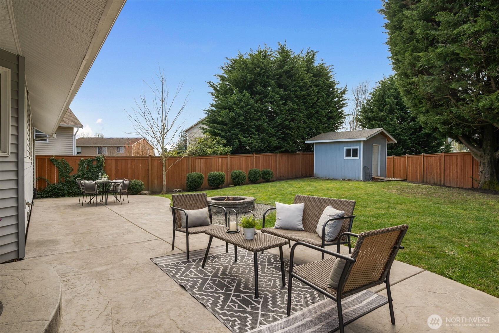 2 109th Place Southeast Everett, WA 98208 - Photo 31 of 40 a patio of a house with table and chairs garden
