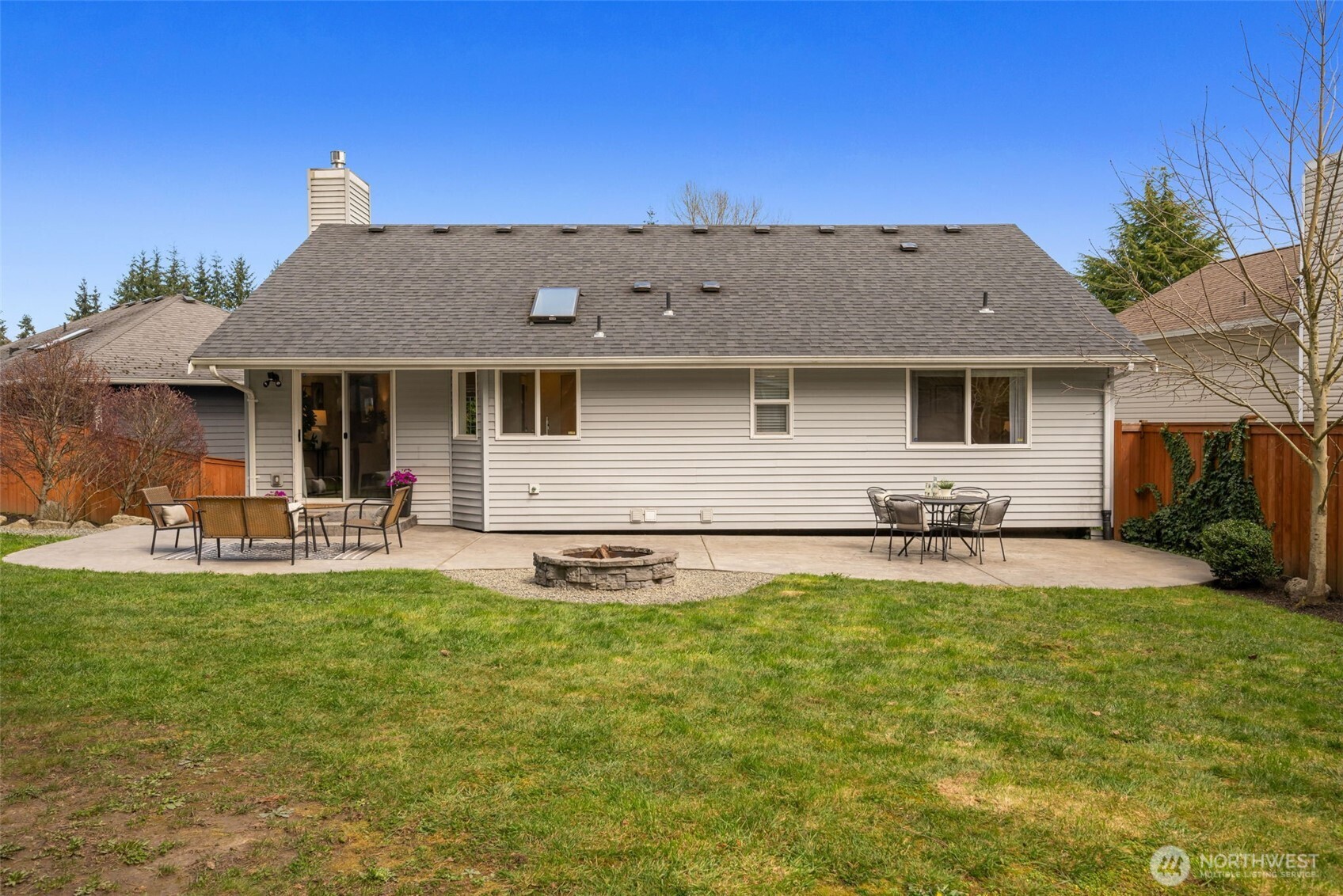 2 109th Place Southeast Everett, WA 98208 - Photo 32 of 40 a view of a house with a yard patio and fire pit
