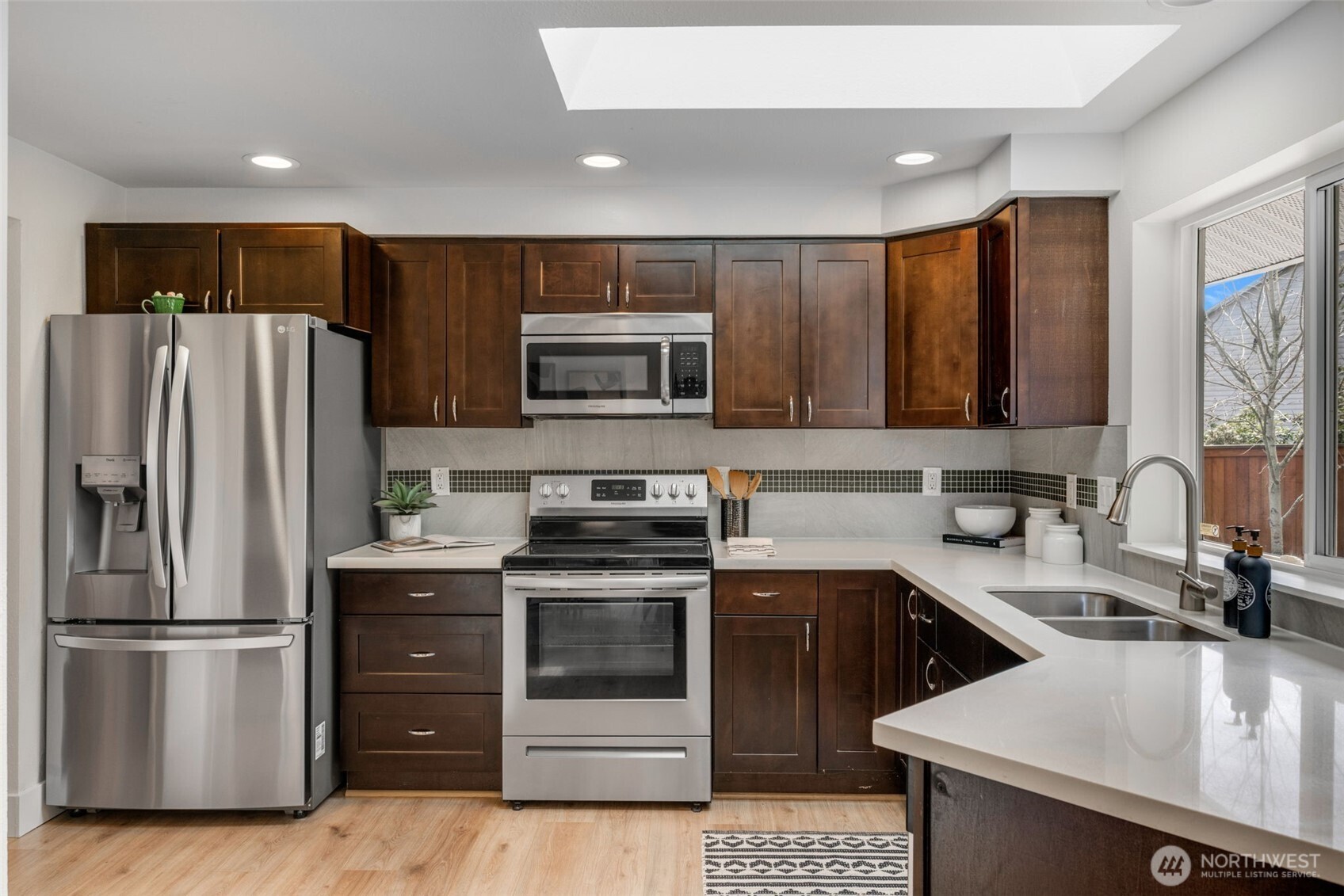2 109th Place Southeast Everett, WA 98208 - Photo 7 of 40 a kitchen with a sink stove and refrigerator