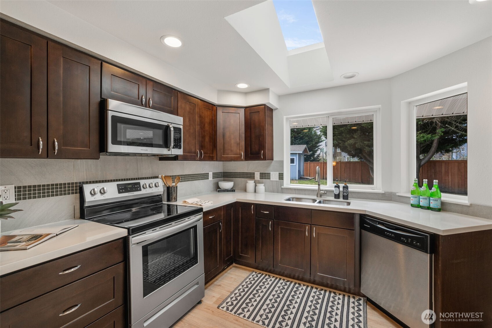 2 109th Place Southeast Everett, WA 98208 - Photo 8 of 40 a kitchen with a sink stove and microwave