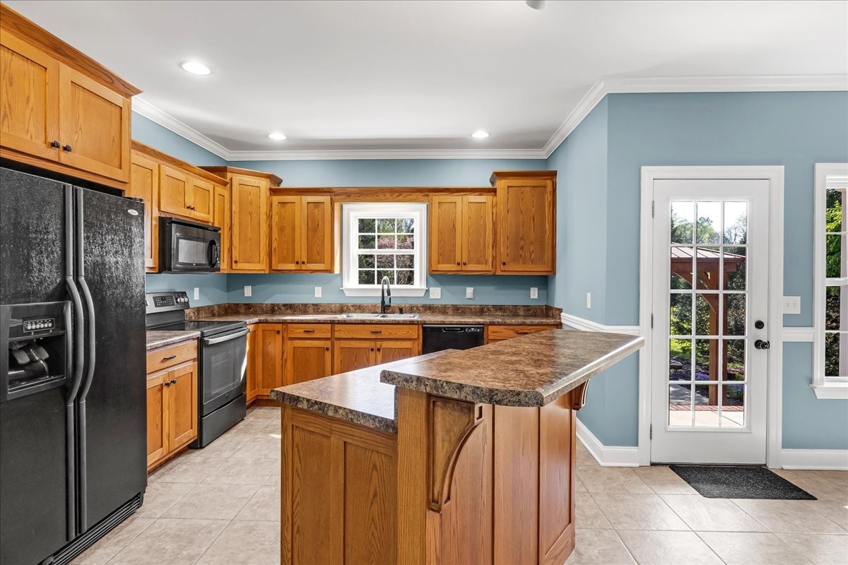 191 Mason Place Decherd, TN 37324 - Photo 12 of 53 a kitchen with stainless steel appliances granite countertop a sink stove refrigerator and cabinets
