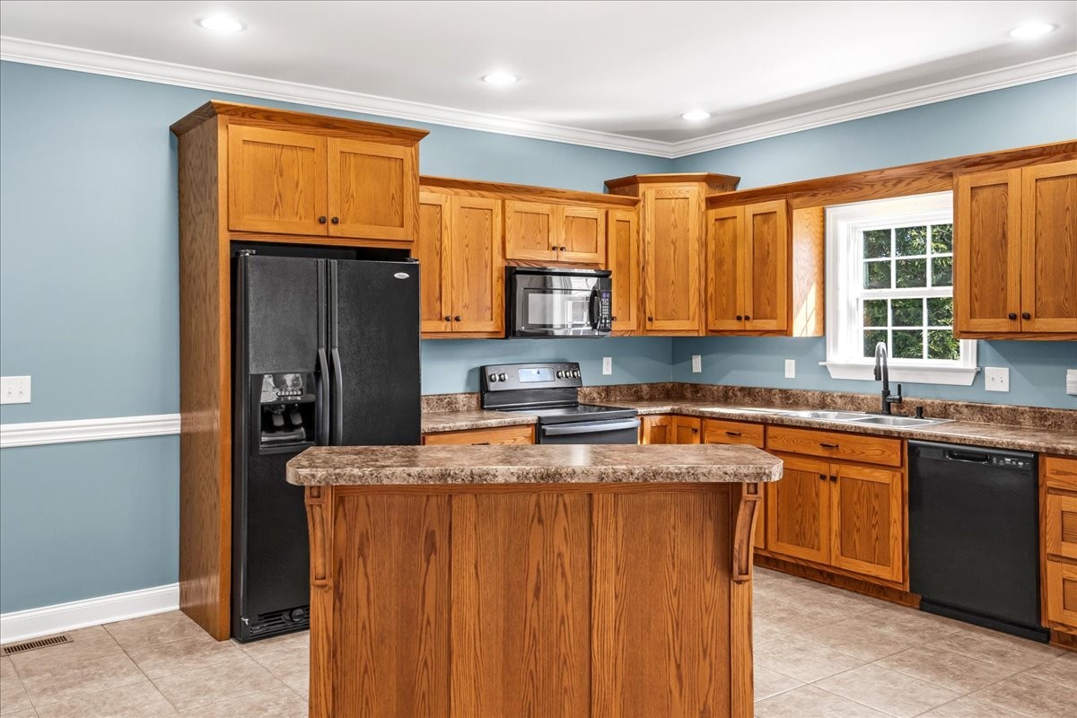 191 Mason Place Decherd, TN 37324 - Photo 13 of 53 a kitchen with stainless steel appliances granite countertop a stove a sink dishwasher and a refrigerator