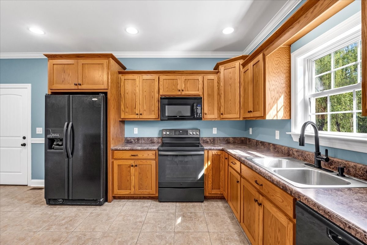 191 Mason Place Decherd, TN 37324 - Photo 15 of 53 a kitchen with stainless steel appliances granite countertop a sink stove and refrigerator