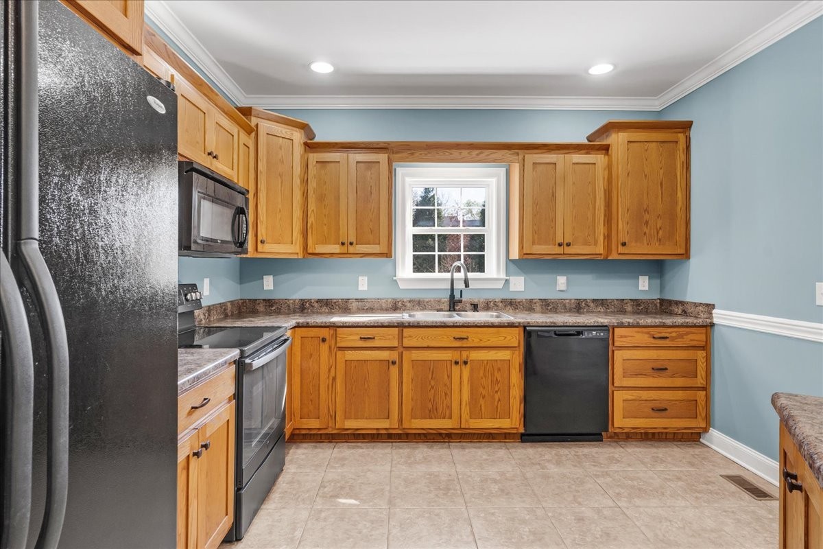 191 Mason Place Decherd, TN 37324 - Photo 16 of 53 a kitchen with stainless steel appliances granite countertop a sink stove and cabinets