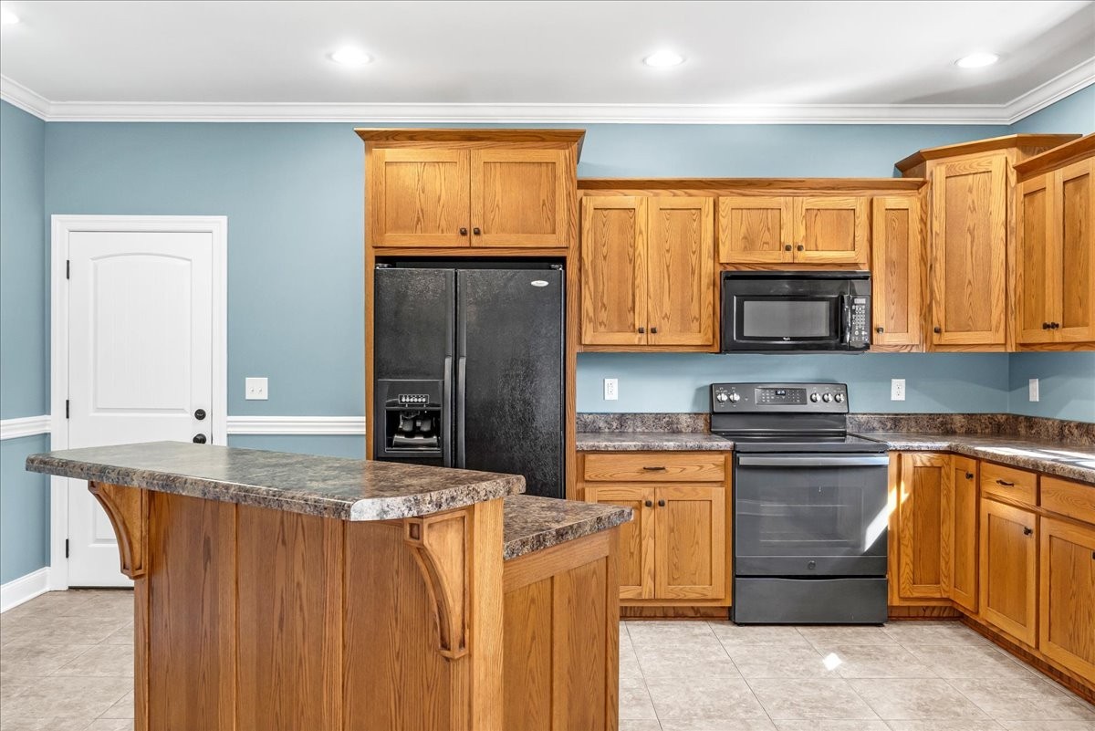 191 Mason Place Decherd, TN 37324 - Photo 18 of 53 a kitchen with stainless steel appliances granite countertop a stove a sink dishwasher and a refrigerator