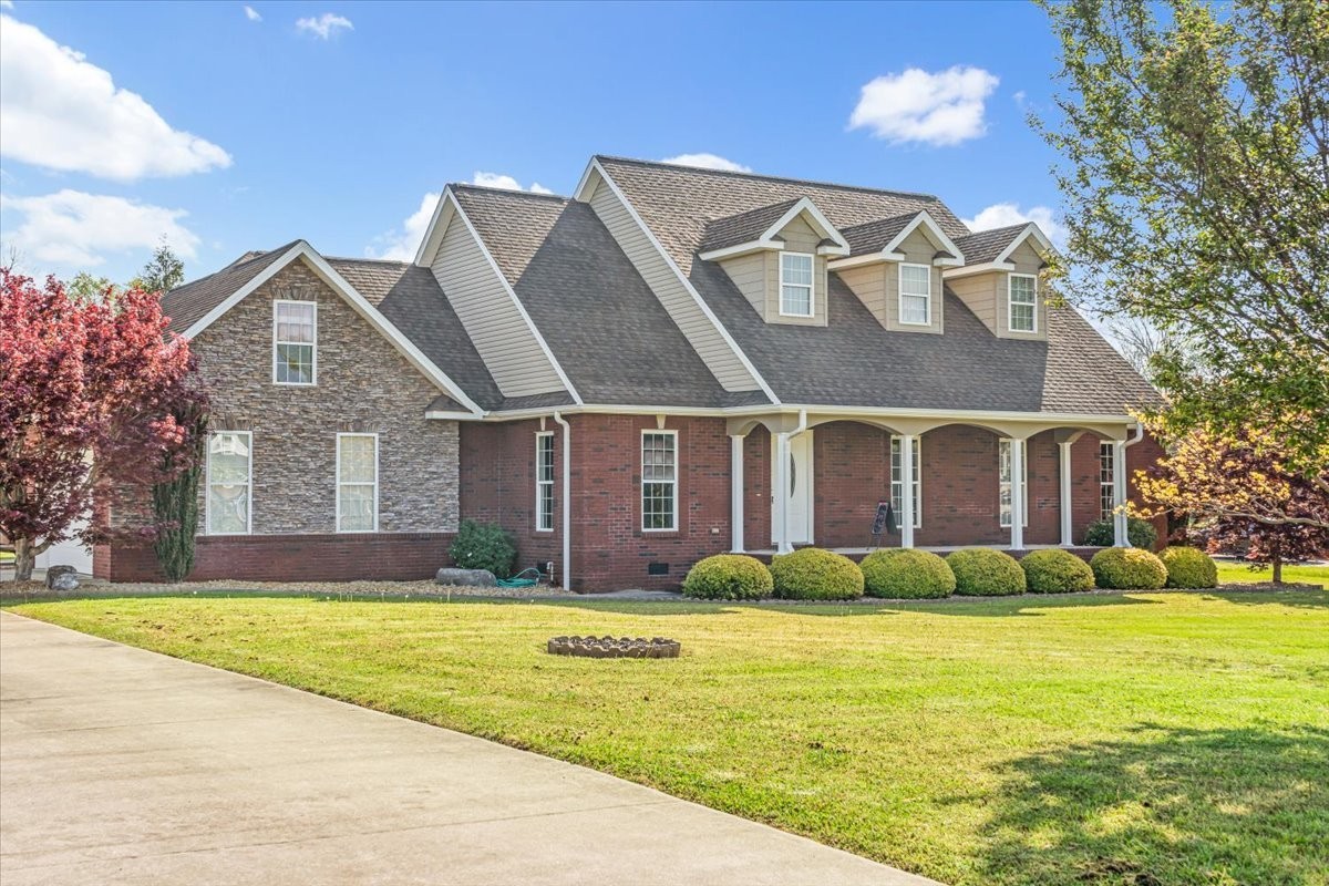 191 Mason Place Decherd, TN 37324 - Photo 2 of 53 a front view of house with yard and green space