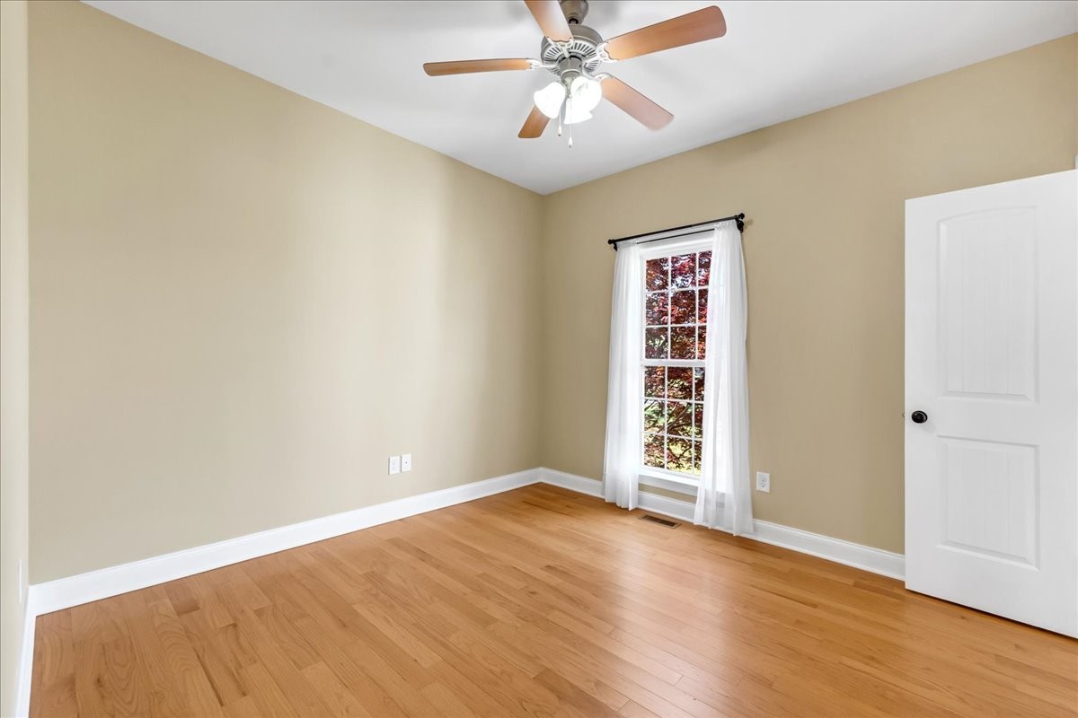 191 Mason Place Decherd, TN 37324 - Photo 28 of 53 a view of an empty room with window and wooden floor