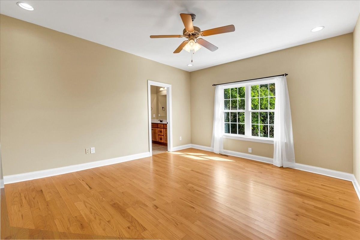 191 Mason Place Decherd, TN 37324 - Photo 30 of 53 an empty room with wooden floor and windows
