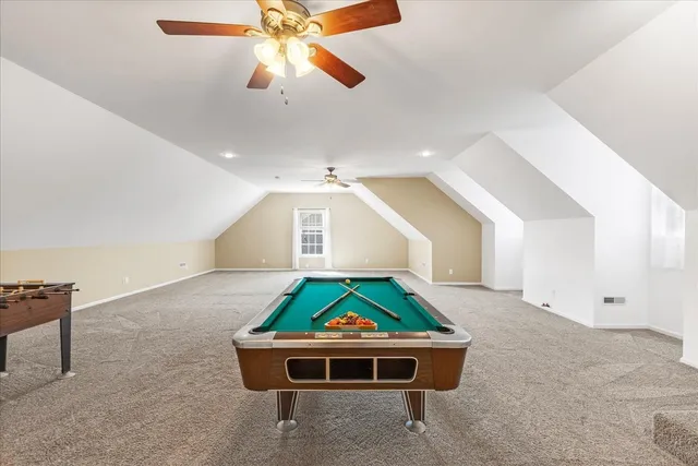 a room with table and ceiling fan