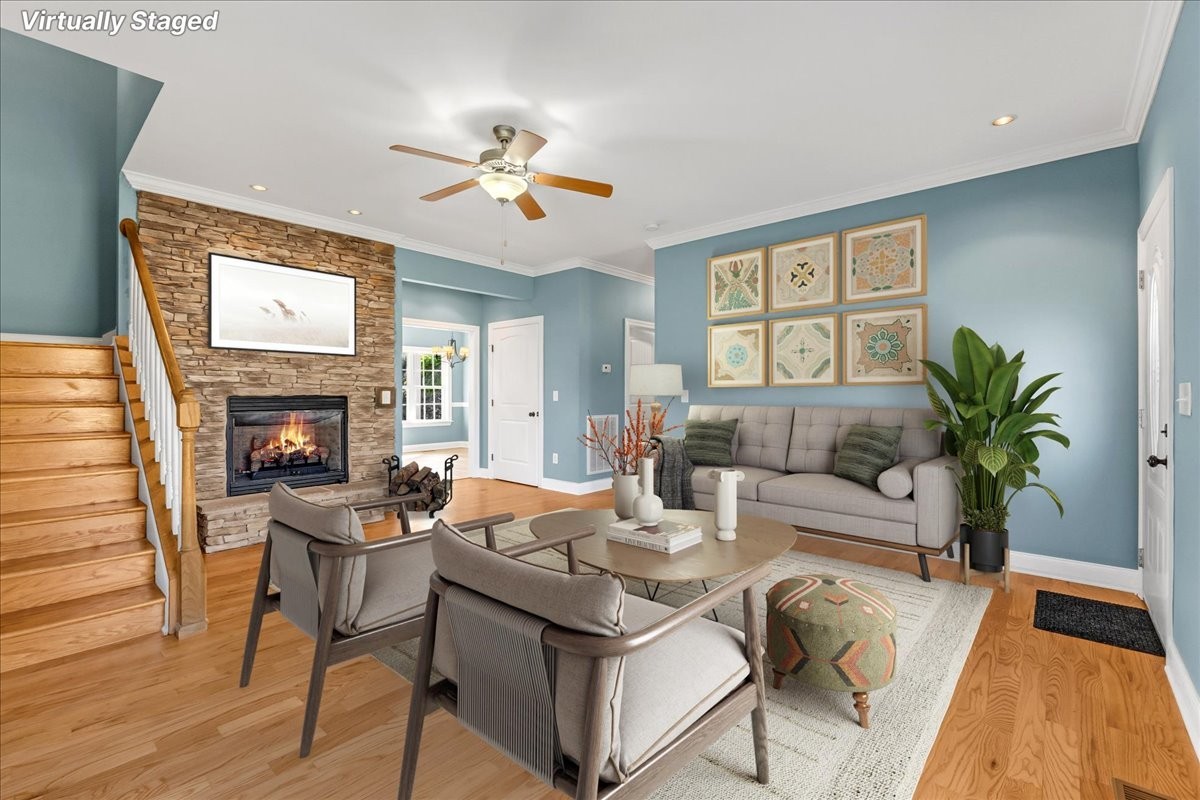 191 Mason Place Decherd, TN 37324 - Photo 10 of 53 a living room with furniture a chandelier and a fireplace