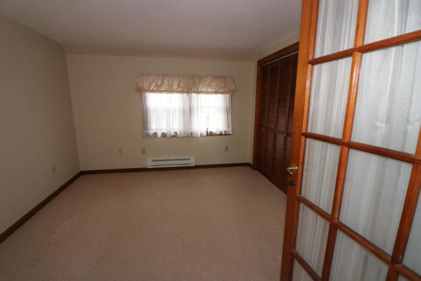 24 Mill Pond Road Orleans, MA 02653 - Photo 12 of 25 an empty room with windows