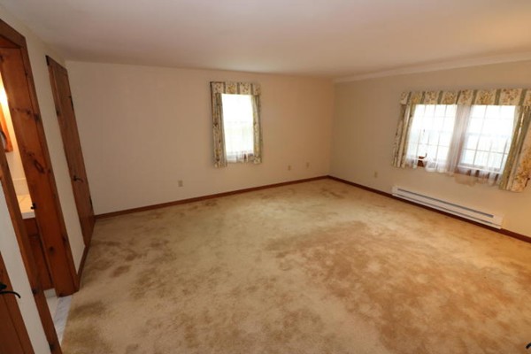 24 Mill Pond Road Orleans, MA 02653 - Photo 10 of 25 an empty room with windows