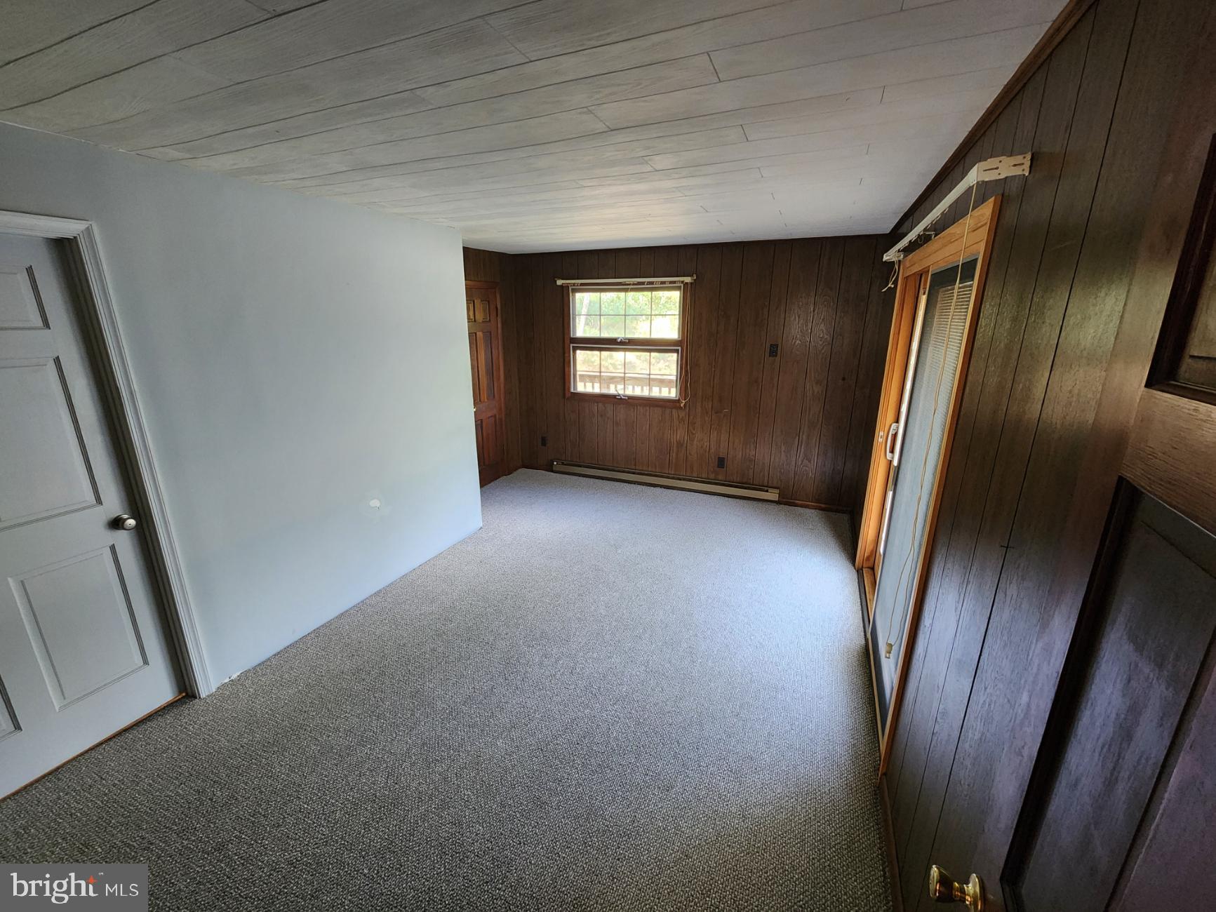 234 Hilltop Loop Road Harpers Ferry, WV 25425 - Photo 4 of 14 Primary bedroom with Pella sliding door to deck