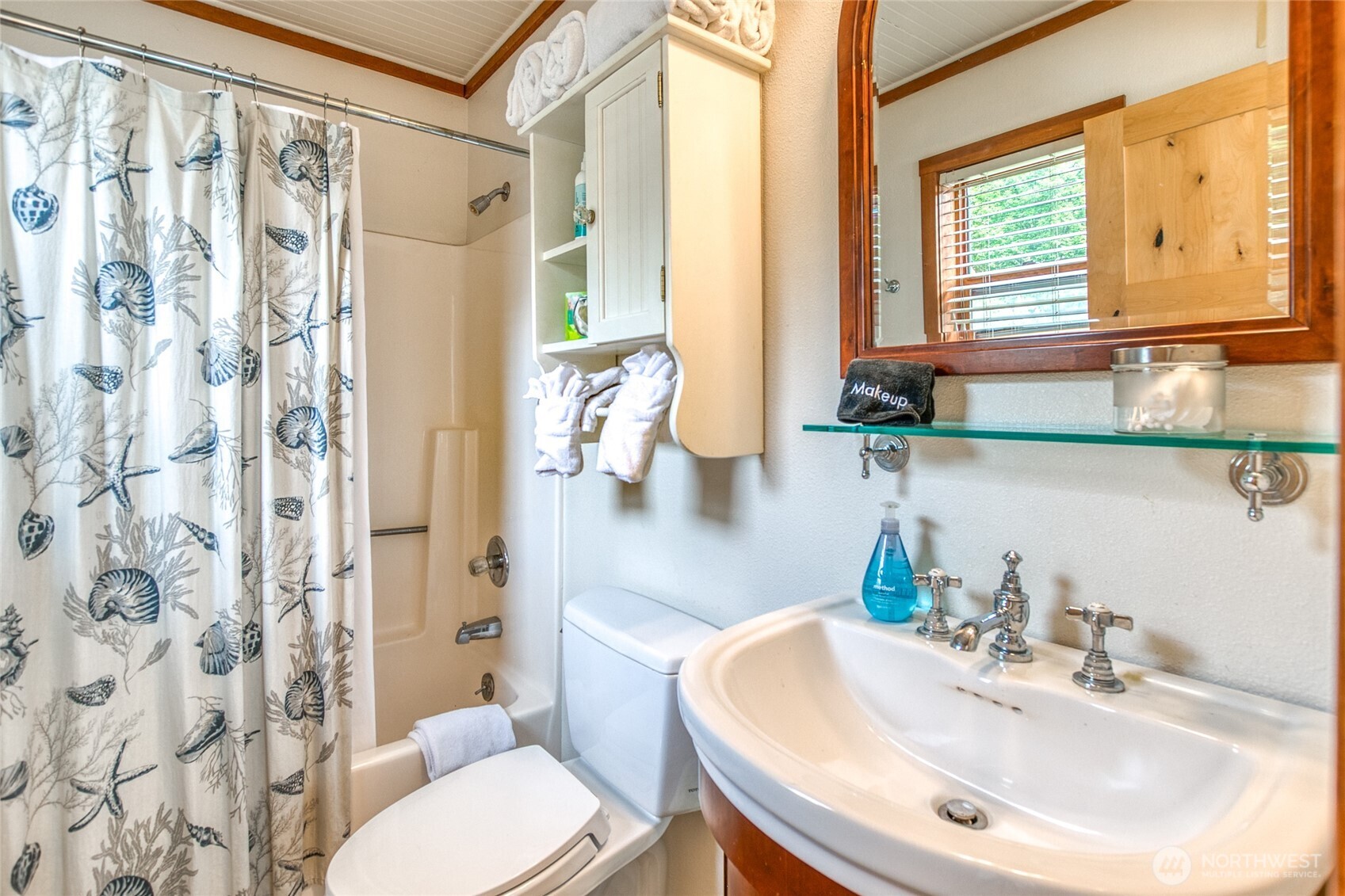 942 Deer Harbor Road Orcas Island, WA 98245 - Photo 28 of 40 a bathroom with a sink a toilet and shower curtain