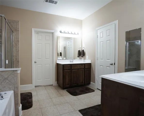 a kitchen with a sink and a refrigerator