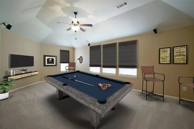 a living room with furniture pool table and a flat screen tv
