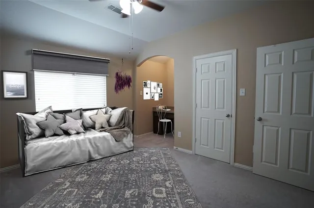 a living room with furniture and a window