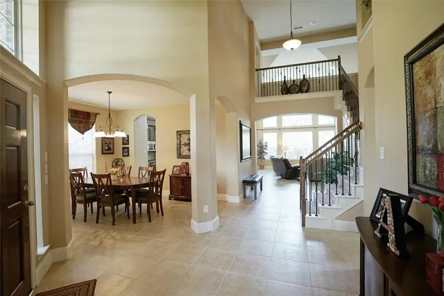 a view of a livingroom with furniture and entryway