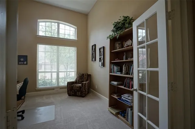 a living room with a flat screen tv and a window