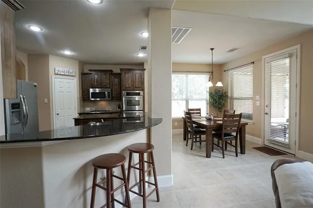 a view of a dining room with furniture