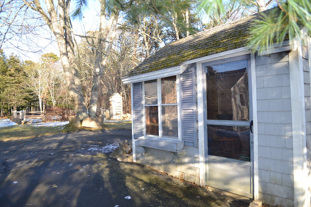 40 Joshua Jethro Road Harwich, MA 02645 - Photo 15 of 22 a front view of a house with a yard