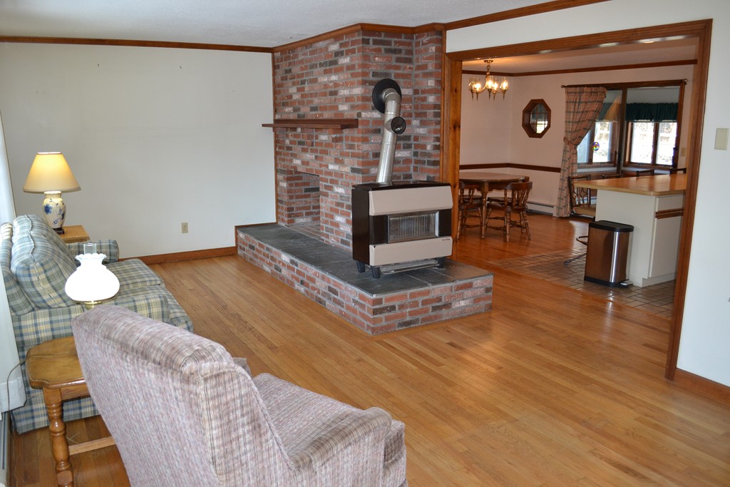 40 Joshua Jethro Road Harwich, MA 02645 - Photo 2 of 22 a living room with furniture and a fireplace