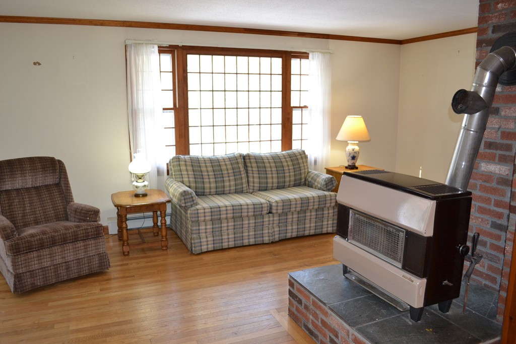 40 Joshua Jethro Road Harwich, MA 02645 - Photo 9 of 22 a living room with furniture and a window