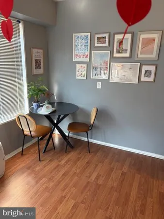 a workspace with furniture window and wooden floor