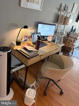a view of a workspace with furniture