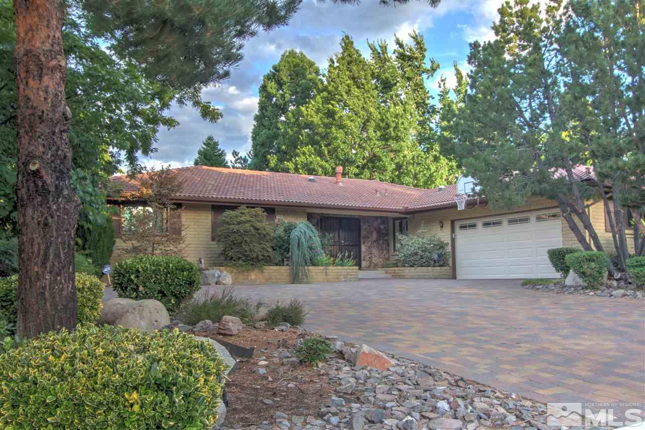1780 Aquila Avenue Reno, NV 89509 - Photo 1 of 1 a front view of a house with a yard