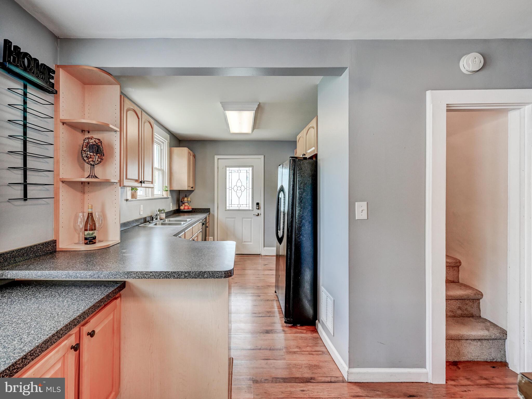 3932 Glenhurst Road Baltimore, MD 21222 - Photo 12 of 47 a kitchen with granite countertop a sink and a stove top oven