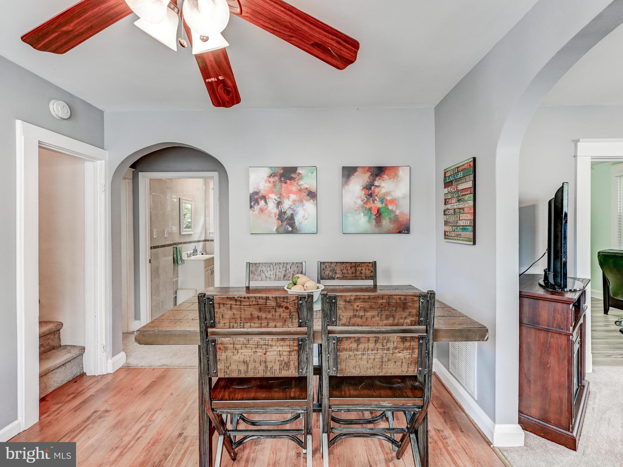 3932 Glenhurst Road Baltimore, MD 21222 - Photo 14 of 47 a view of a dining room with furniture and wooden floor