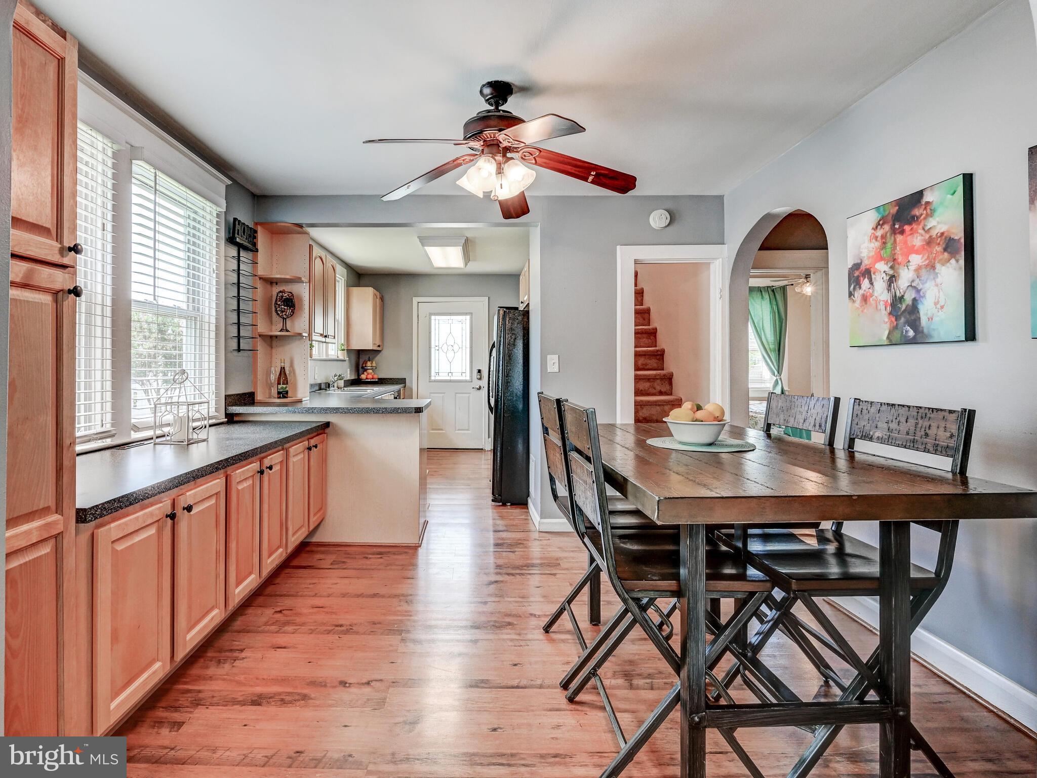 3932 Glenhurst Road Baltimore, MD 21222 - Photo 16 of 47 a large kitchen with a table and chairs