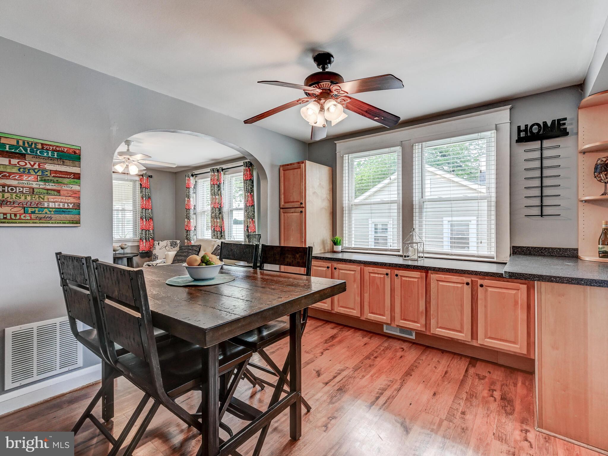 3932 Glenhurst Road Baltimore, MD 21222 - Photo 17 of 47 a view of a dining room with furniture wooden floor and chandelier