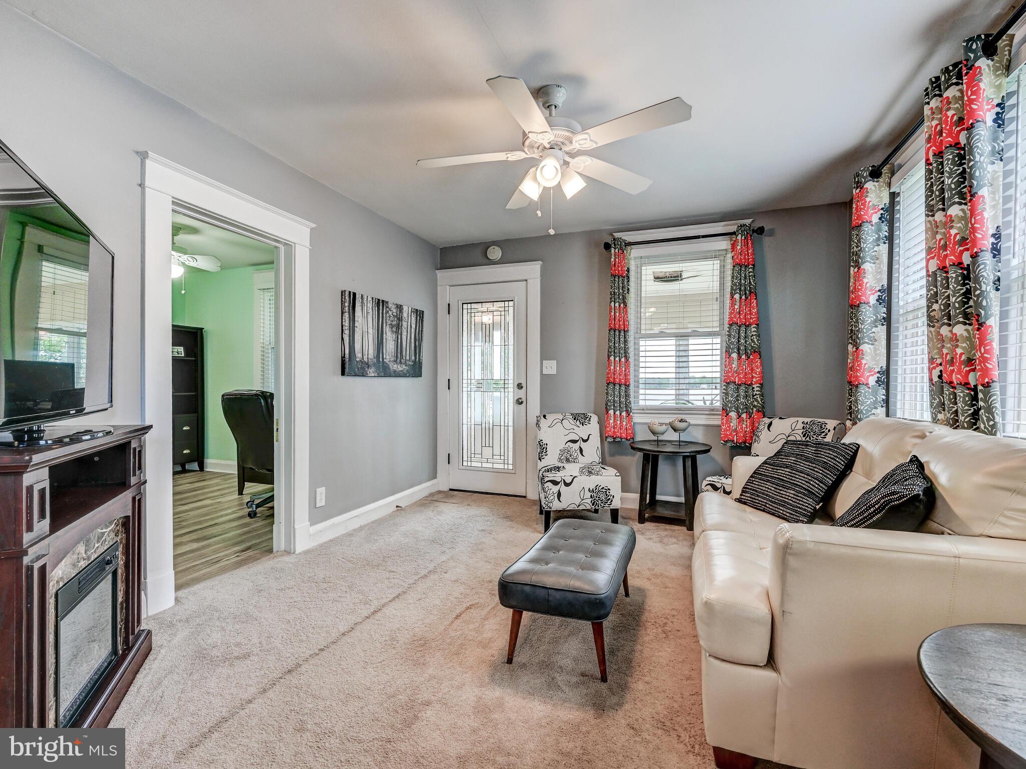 3932 Glenhurst Road Baltimore, MD 21222 - Photo 18 of 47 a living room with furniture and a flat screen tv
