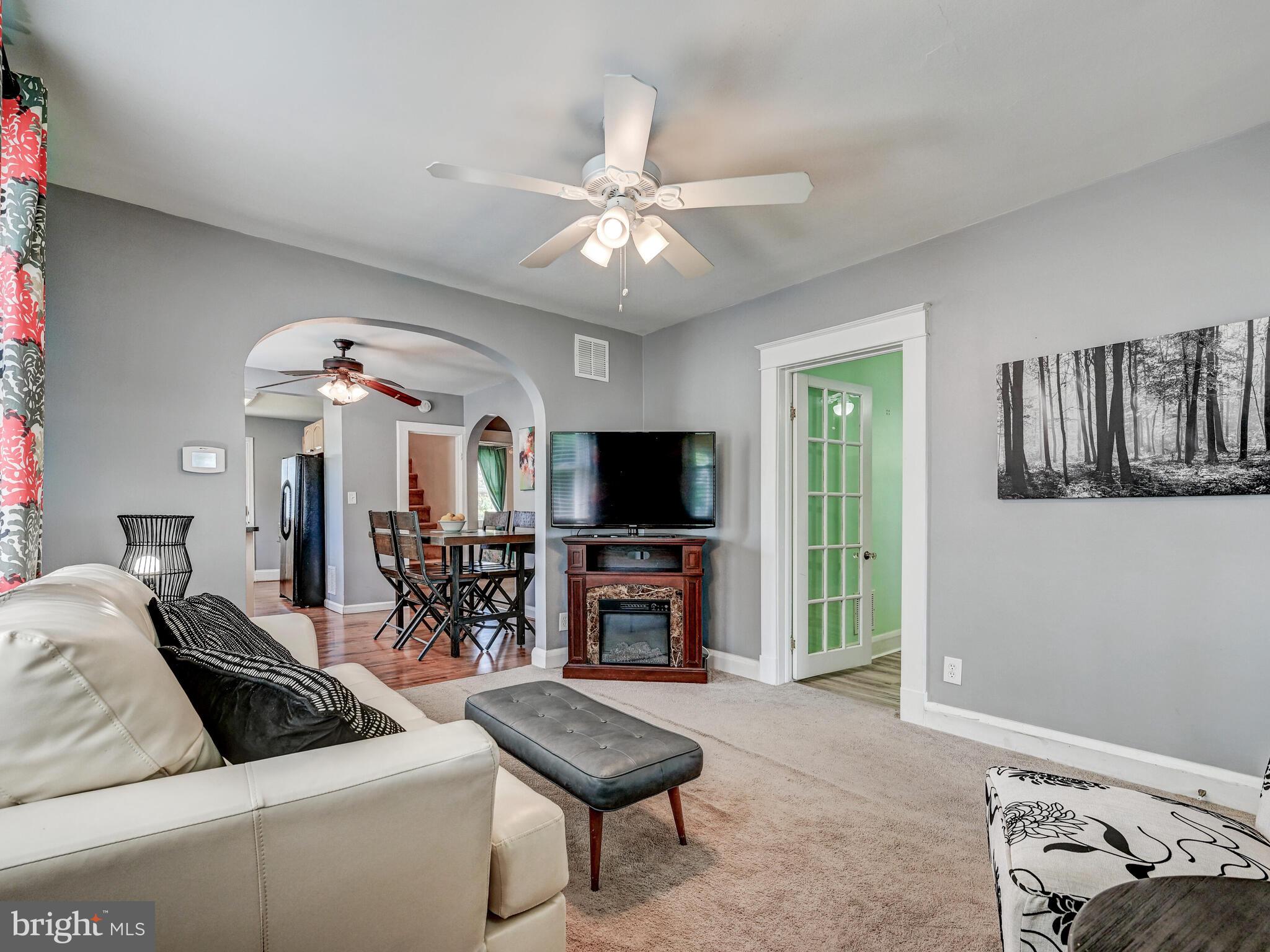 3932 Glenhurst Road Baltimore, MD 21222 - Photo 19 of 47 a living room with furniture and a flat screen tv
