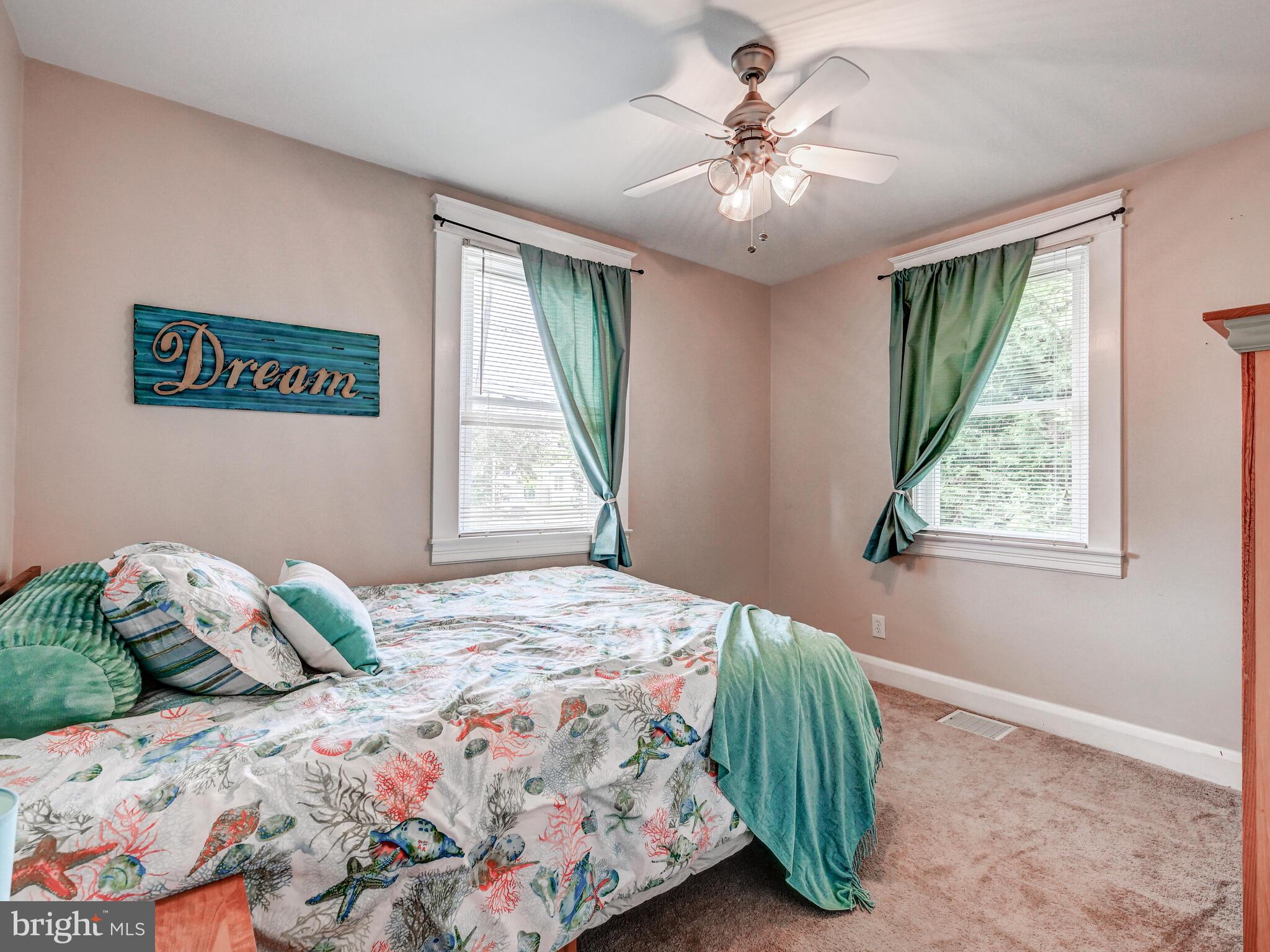 3932 Glenhurst Road Baltimore, MD 21222 - Photo 24 of 47 a bedroom with a bed and a window