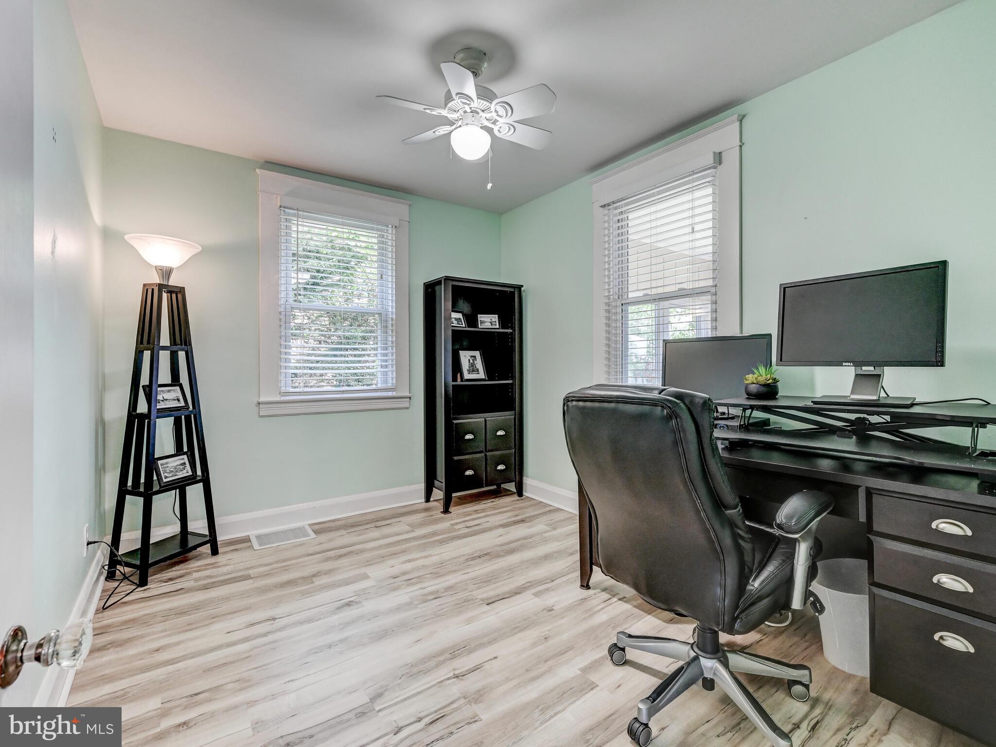 3932 Glenhurst Road Baltimore, MD 21222 - Photo 25 of 47 a view of a workspace with furniture and a window