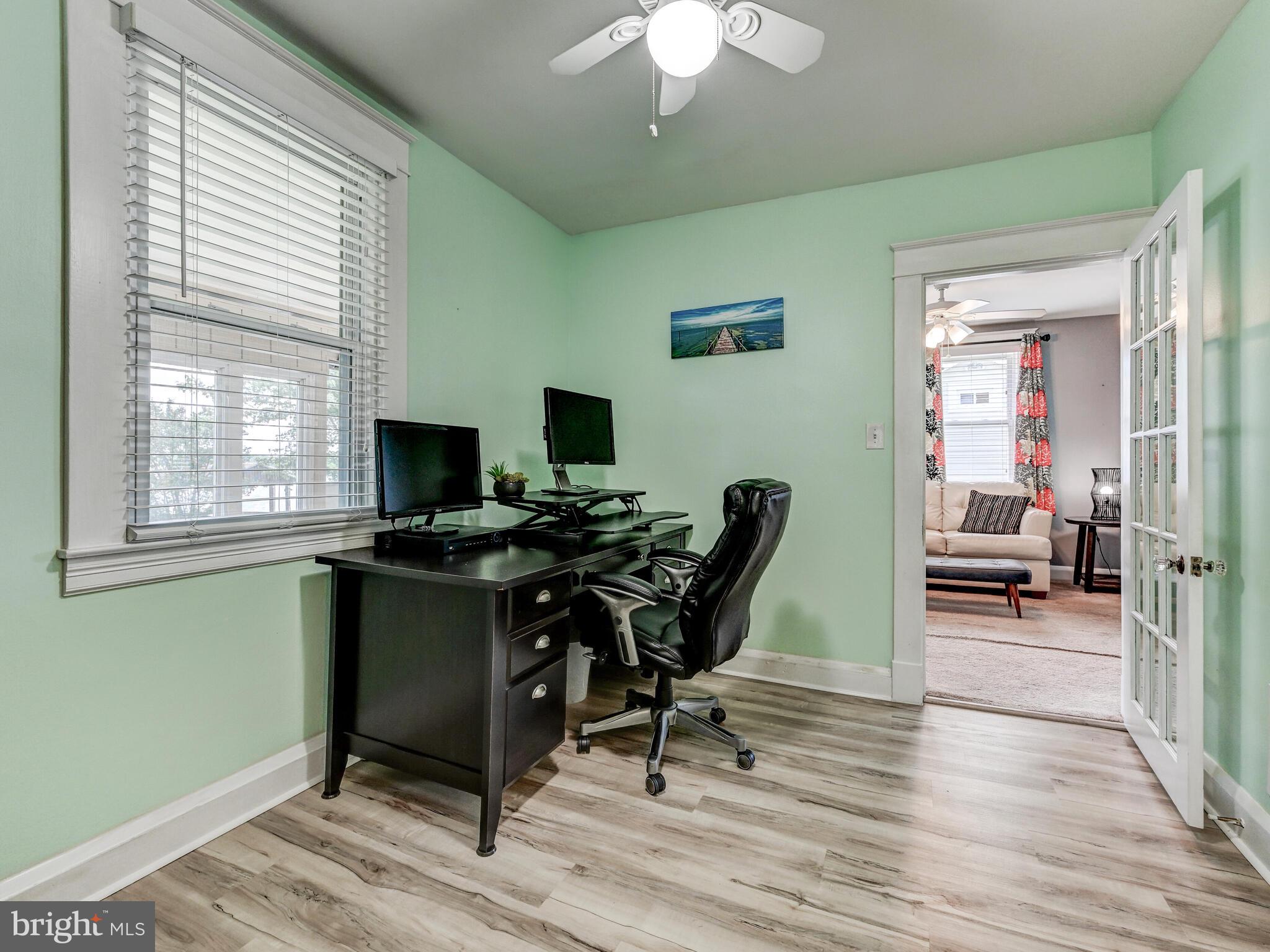 3932 Glenhurst Road Baltimore, MD 21222 - Photo 26 of 47 a view of a workspace with furniture and a window