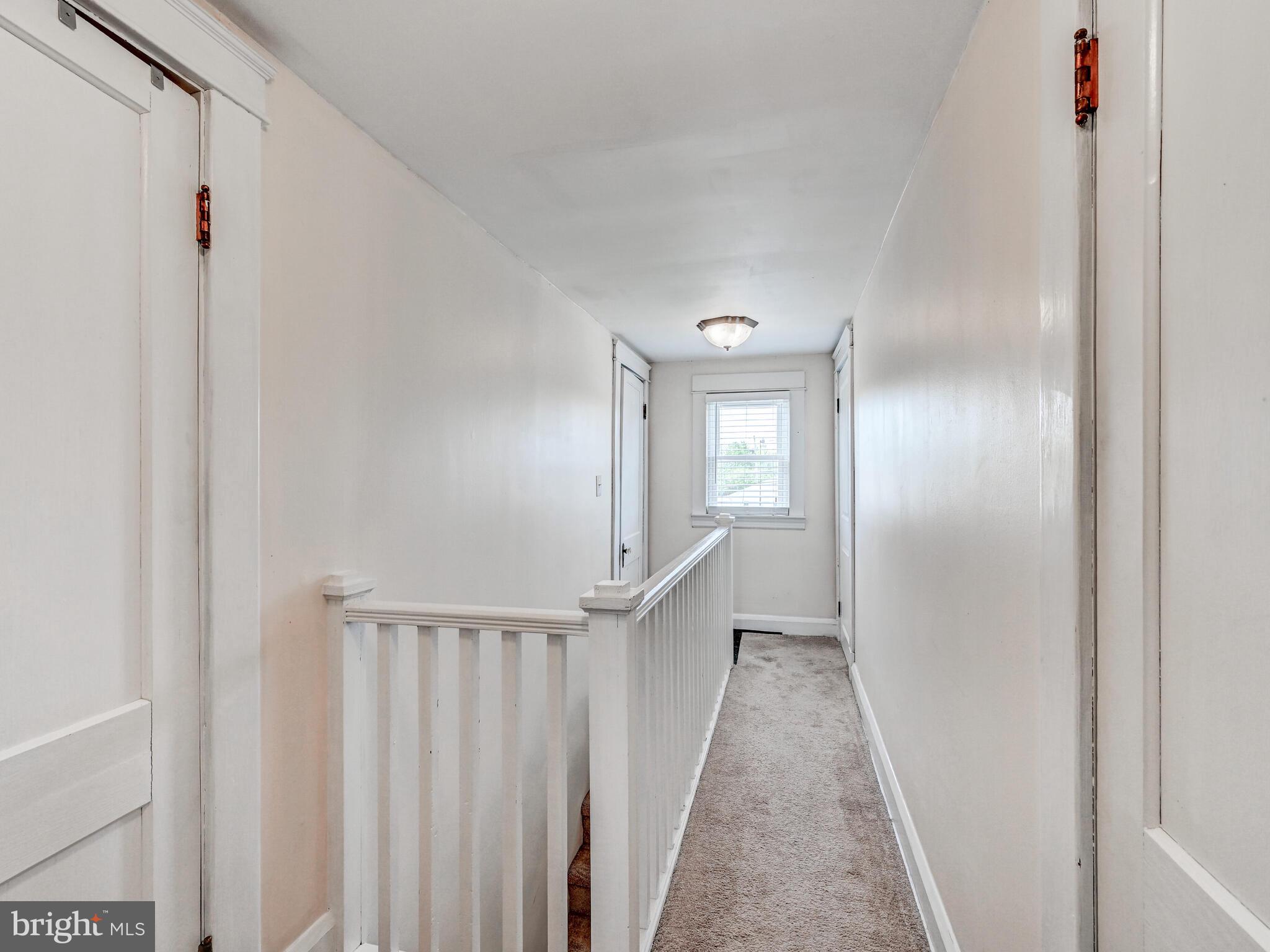 3932 Glenhurst Road Baltimore, MD 21222 - Photo 29 of 47 a view of a hallway with wooden floor and entryway