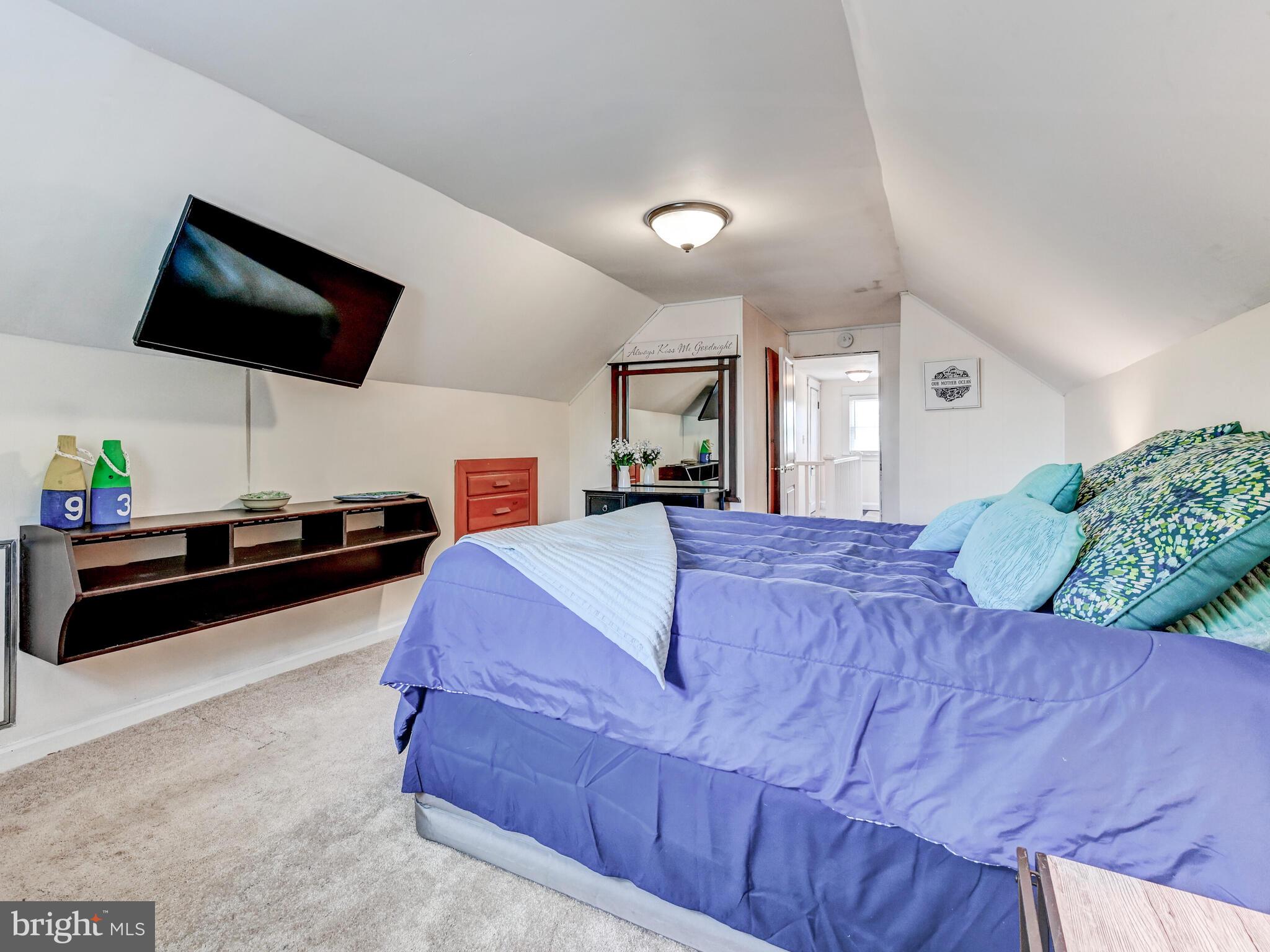 3932 Glenhurst Road Baltimore, MD 21222 - Photo 31 of 47 a bedroom with a bed and a flat screen tv