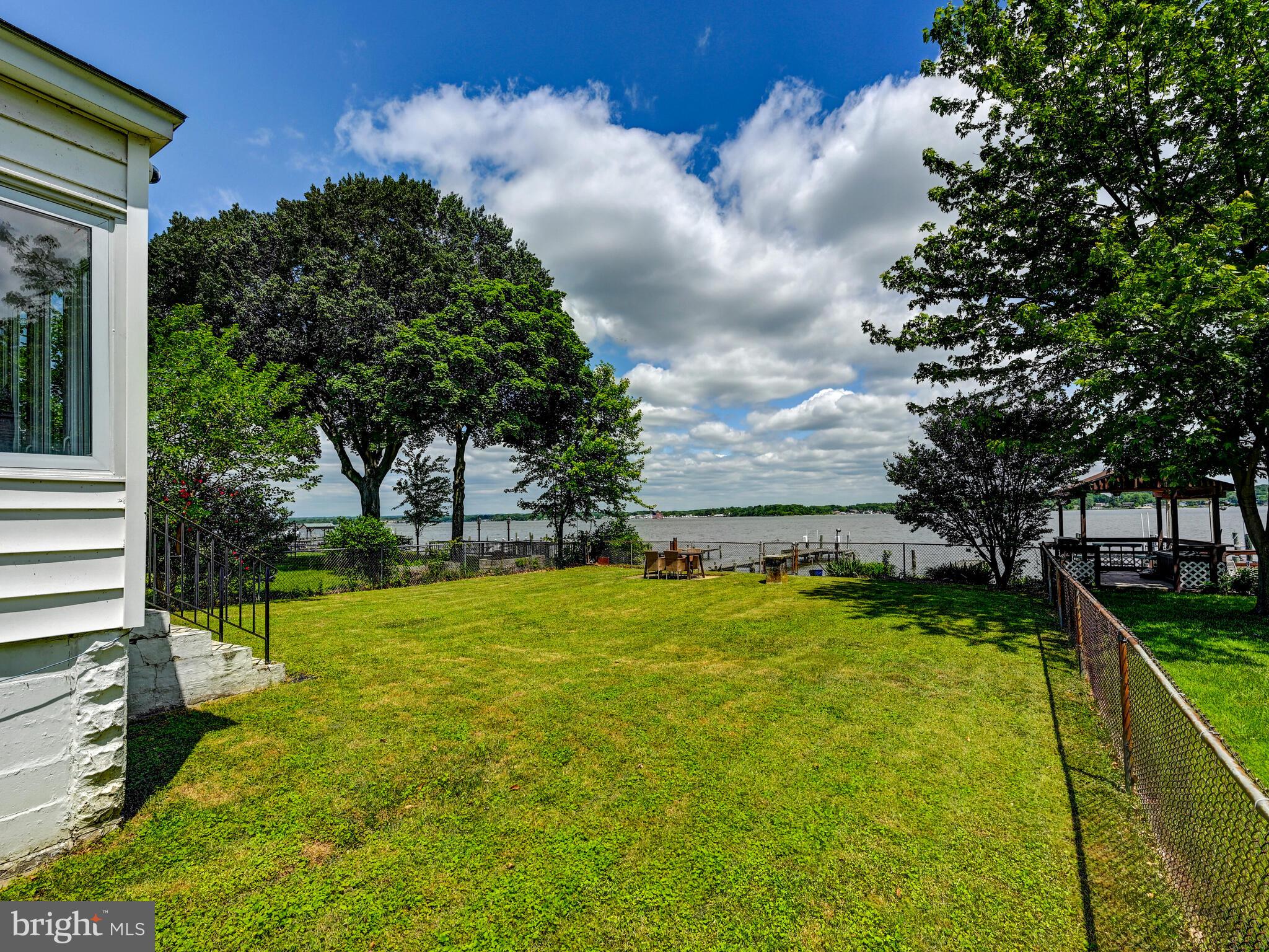3932 Glenhurst Road Baltimore, MD 21222 - Photo 37 of 47 a view of swimming pool with lawn chairs and plants