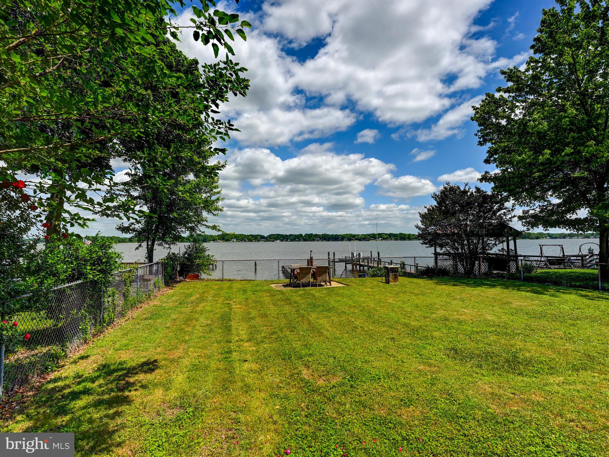 3932 Glenhurst Road Baltimore, MD 21222 - Photo 39 of 47 a view of a swimming pool with an outdoor space and seating area