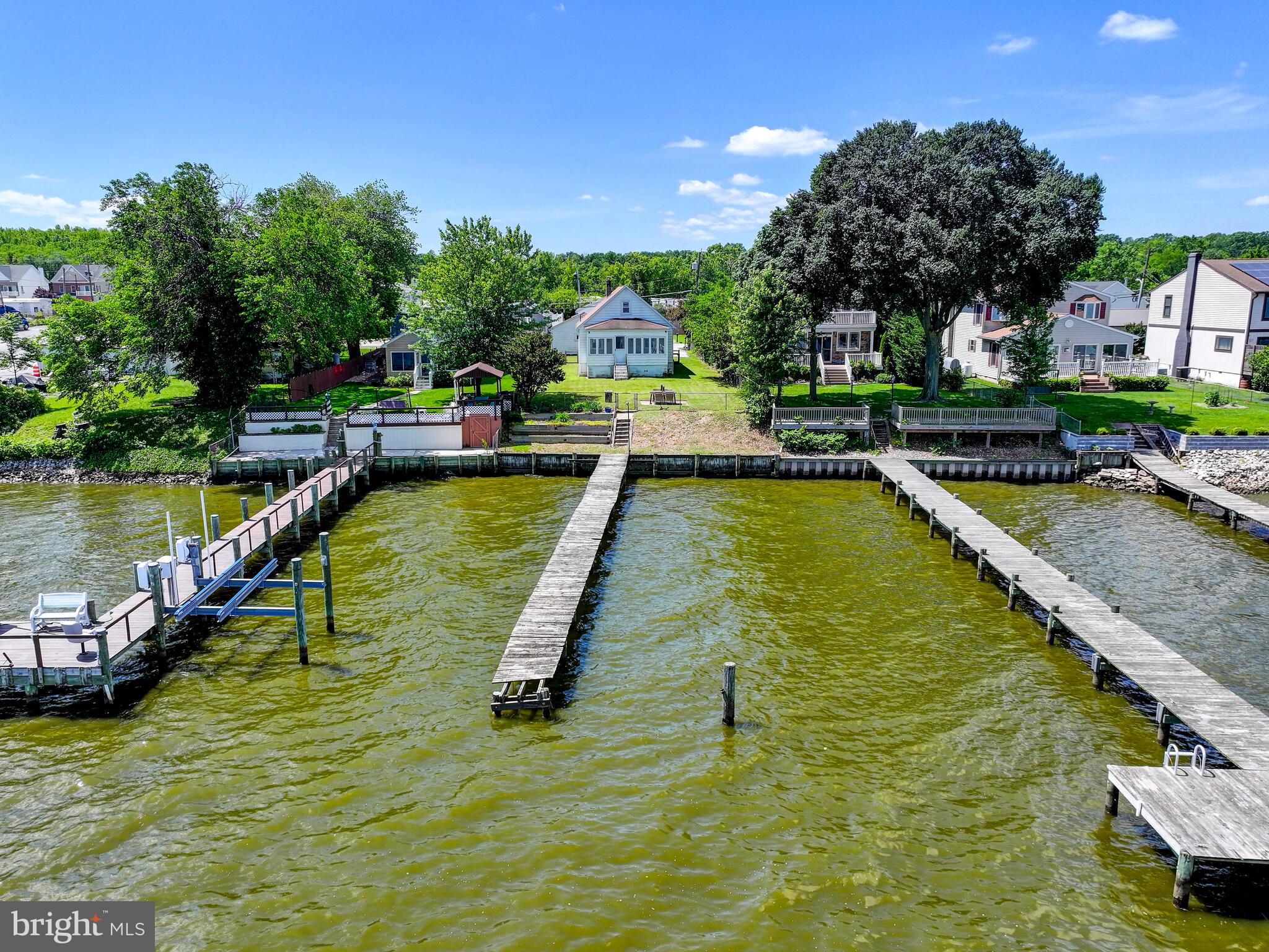 3932 Glenhurst Road Baltimore, MD 21222 - Photo 41 of 47 a view of swimming pool with outdoor seating and trees in the background