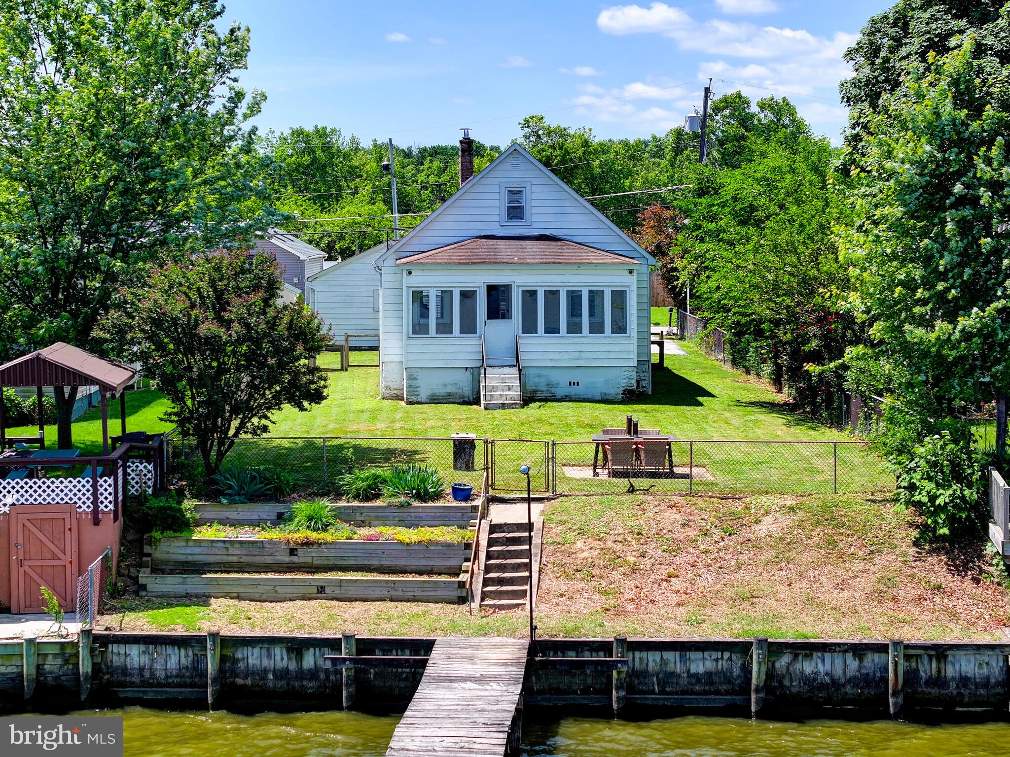 3932 Glenhurst Road Baltimore, MD 21222 - Photo 42 of 47 a front view of a house with garden