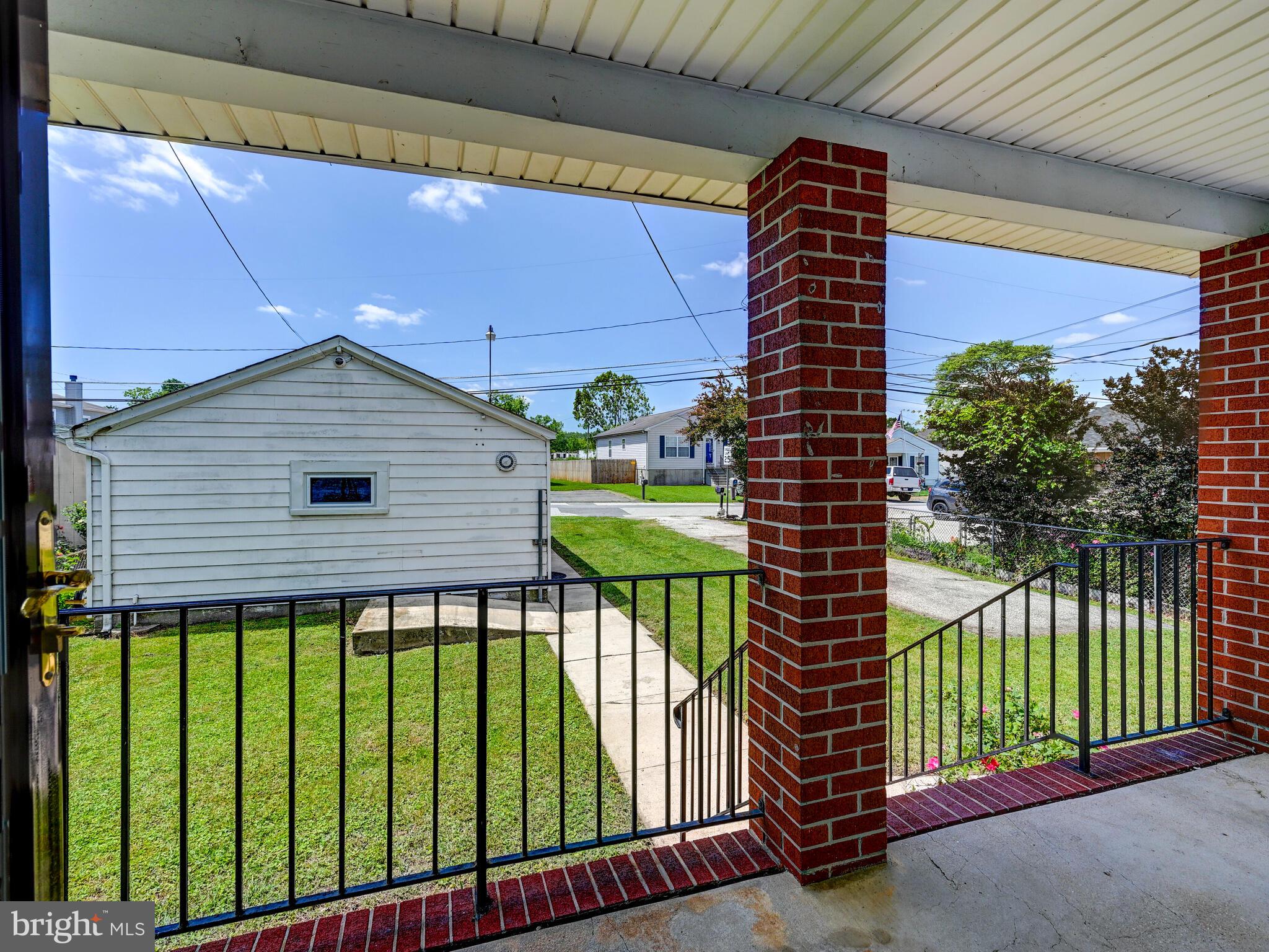 3932 Glenhurst Road Baltimore, MD 21222 - Photo 6 of 47 a house view with a garden space